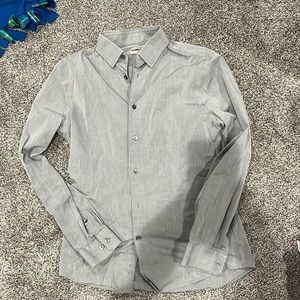 Men’s silver/gray button up dress shirt.